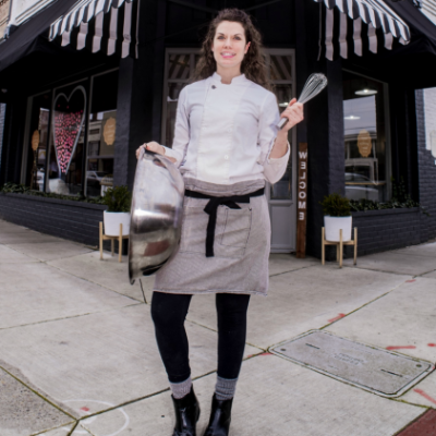 Jolene standing outside her storefront